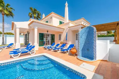 a villa with a swimming pool and a house at Villa Minerva in Albufeira