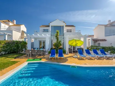 a villa with a swimming pool and chairs and a house at Villa Villa Blue Ocean by Interhome in Patroves