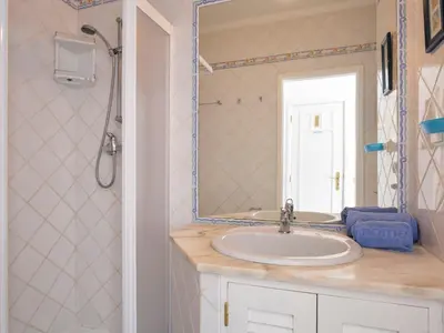 a bathroom with a sink and a mirror at Villa Villa Blue Ocean by Interhome in Patroves