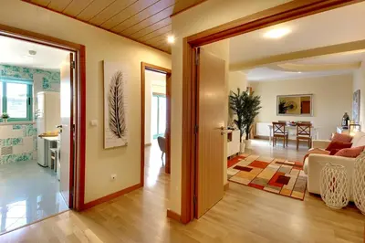 a living room with a couch and a table at Marina Ocean Residence in Albufeira