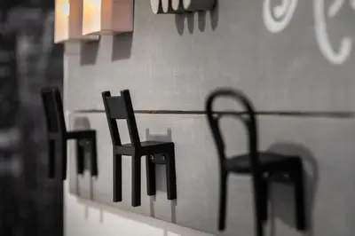 two black chairs sitting on a counter in a room at Kwadalayo Art Quarters in Faro