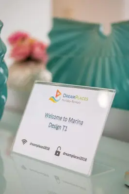 a sign that says welcome to meetings on a table at Marina Design T1 in Albufeira