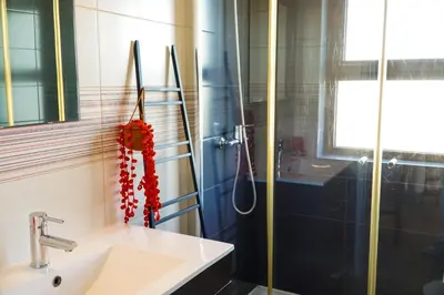 a bathroom with a sink and a shower at Villa Marrachinho in Albufeira