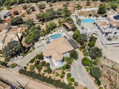 an aerial view of a house with a swimming pool at Villa Redonda in Loulé