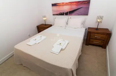 a bedroom with a bed with two towels on it at Apartment Aveiros Beach- D´Alma Amado in Albufeira
