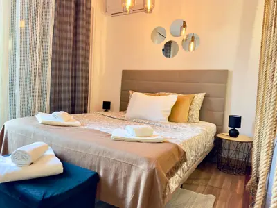 a bedroom with a bed with two towels on it at Cozy and Stylish Studio Apt - just 800m from the beach in Albufeira