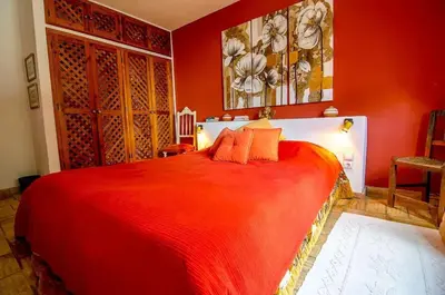a red bedroom with a large bed in a room at Elegant Villa in Loulé with Private Pool in Loulé