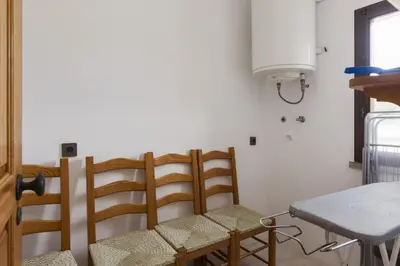a dining room with chairs and a table at Vila de Santa Eulália - Albufeira in Albufeira