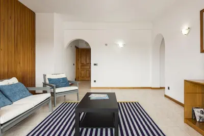 a living room with a couch and a table at Vila de Santa Eulália - Albufeira in Albufeira