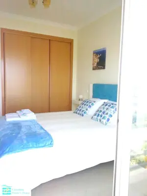 a bedroom with a large bed with towels on it at Bright apartment with sea view in Albufeira - 62 m², Pool in Albufeira