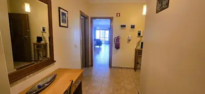 a bathroom with a sink and a mirror on a wall at Open Space - Albufeira in Albufeira