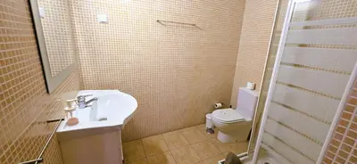 a bathroom with a sink and a toilet at Odete Túnel - Albufeira in Albufeira