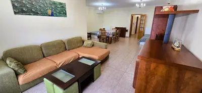 a living room with a couch and a table at Odete Túnel - Albufeira in Albufeira