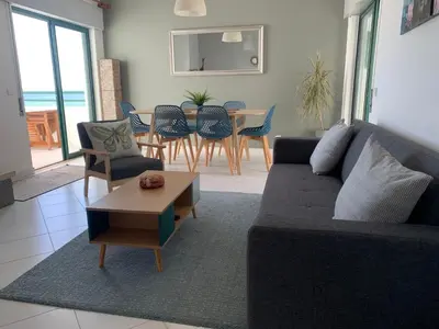 a living room with a couch and a table at CosyAvenida Mar, 2 rooms in Quarteira