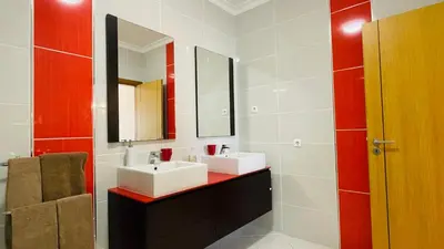 a bathroom with two sinks and a mirror at Santa Maria N by Check-in Portugal in Albufeira