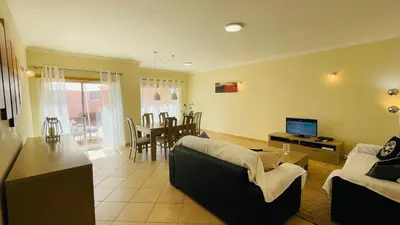 a living room with a couch and a table at Santa Maria N by Check-in Portugal in Albufeira