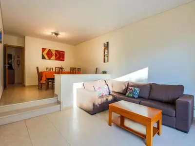 a living room with a couch and a table at V4, Villa Jardins Branqueira2 near Beach, Albufeira in Albufeira