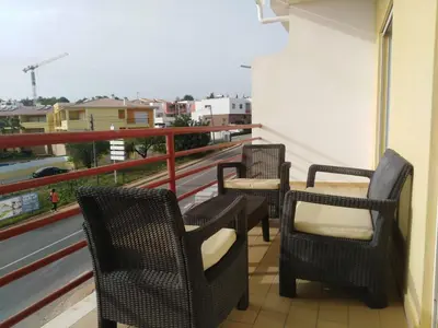 three chairs sitting on a balcony with a view at Salgados Sea View Apartment in Albufeira