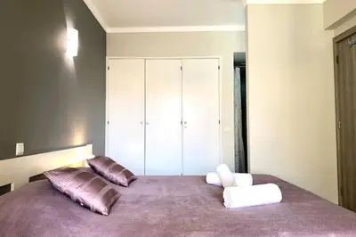a bedroom with a large bed with two pillows at Poente da Aldeia apartment in Albufeira