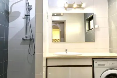 a bathroom with a sink and a shower at Poente da Aldeia apartment in Albufeira