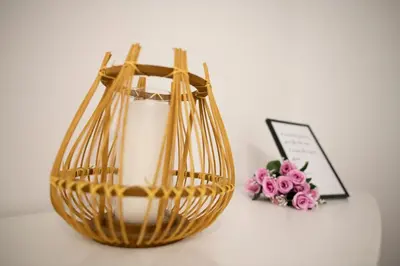 a basket and a bouquet of pink flowers and a picture at Pool and Garden Village-near beach in Albufeira