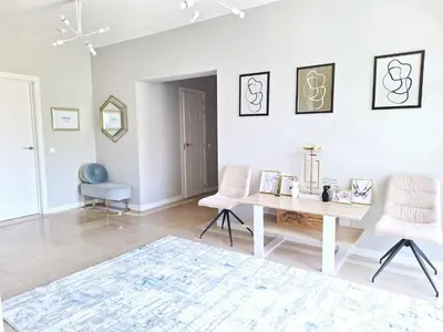 a white room with a table and two chairs at Feliz Algarve in Albufeira