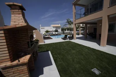 a house with a yard with a swimming pool at Casa Corais in Guia