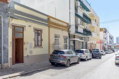 a group of cars parked on the side of a street at FLH Faro Central House with Terrace in Faro