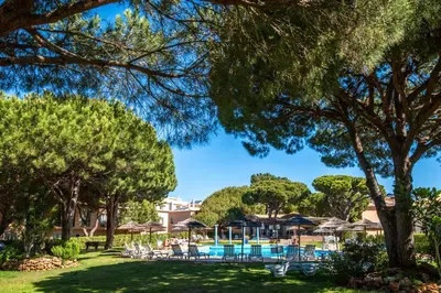 a park with a playground and tables and trees at Charm Apartment T2 All With Big Terrace Albufeira Self check-in in Albufeira