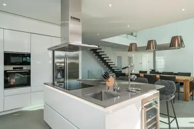 a kitchen with a sink and a counter top at Victoria Lux by SAPvillas in Vilamoura