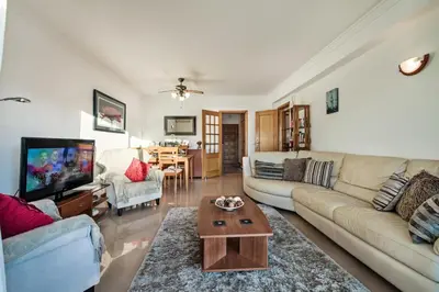 a living room with a couch and a coffee table at Apt Galé Garden AA by Algarve Villa Holidays in Albufeira