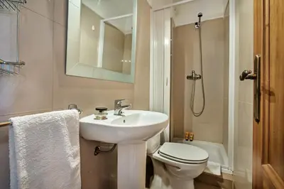 a bathroom with a sink and a toilet and a shower at Apt Galé Garden AA by Algarve Villa Holidays in Albufeira