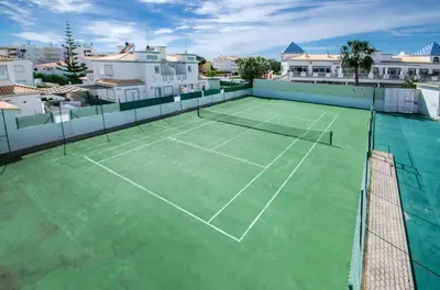 a tennis court on top of a house at Apt O Monte AG by Algarve Villa Holidays in Albufeira