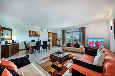 a living room with a couch and a table at Apt Galé Mar 11 by Algarve Villa Holidays in Galé