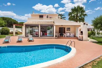 a villa with a swimming pool and a house at Isabel by Algarve Villa Holidays in Galé