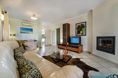 a living room with a couch and a tv at Julieta by Algarve Villa Holidays in Galé