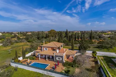 an aerial view of a house with a swimming pool at Laura by Algarve Villa Holidays in Albufeira