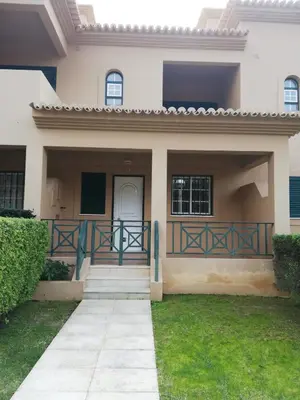 a house with a gate and a porch at Villa V2 C in Albufeira