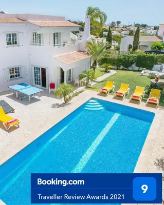 a villa with a swimming pool and a house at Vivenda Gabriel #vivgabriel in Albufeira