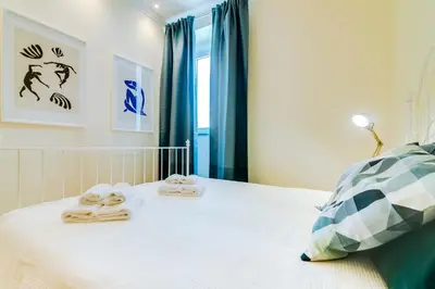 a bedroom with a bed with towels on it at Casa Azul Traditional House - Faro in Faro