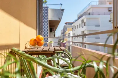 a bowl of oranges sitting on a table on a balcony at Magic Theatre Faro Center in Faro