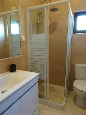 a bathroom with a shower and a sink and a toilet at Vilamoura Fantástica Moradia com Piscina Privada in Vilamoura