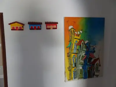a painting of a building on a wall at Vilamoura Fantástica Moradia com Piscina Privada in Vilamoura