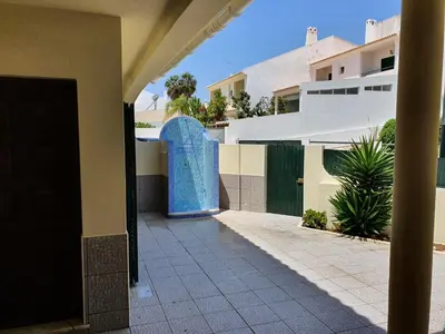 a blue door on the side of a building at Algarve Villa Albufeira Altos dos Caliços in Albufeira