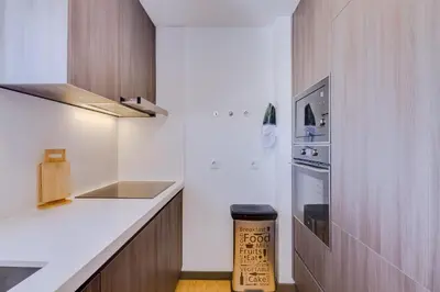 a kitchen with a counter and a stove top oven at Gold Suites - Luxurious apartment - Sea view in Vilamoura