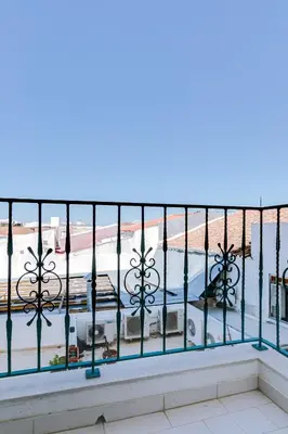 a balcony with a view of a pool at Mango Apartment - Faro city center in Faro