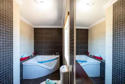 a bathroom with two tubs and a toilet at Villa Laguna by Algarve Vacation in Albufeira