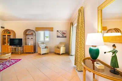 a living room with a couch and a table at WHome | Vilamoura Family Apartment in Quarteira