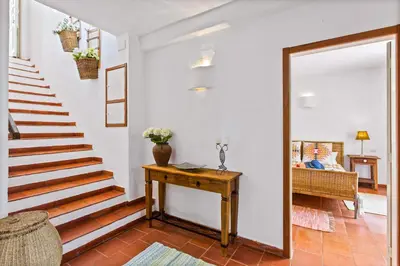 a living room with a red couch on a patio at Villa Namibe na Quinta da Balaia in Albufeira