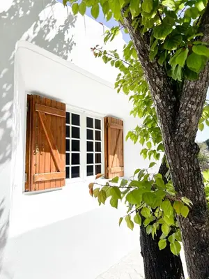 a pair of doors on a white building at Villa Namibe na Quinta da Balaia in Albufeira